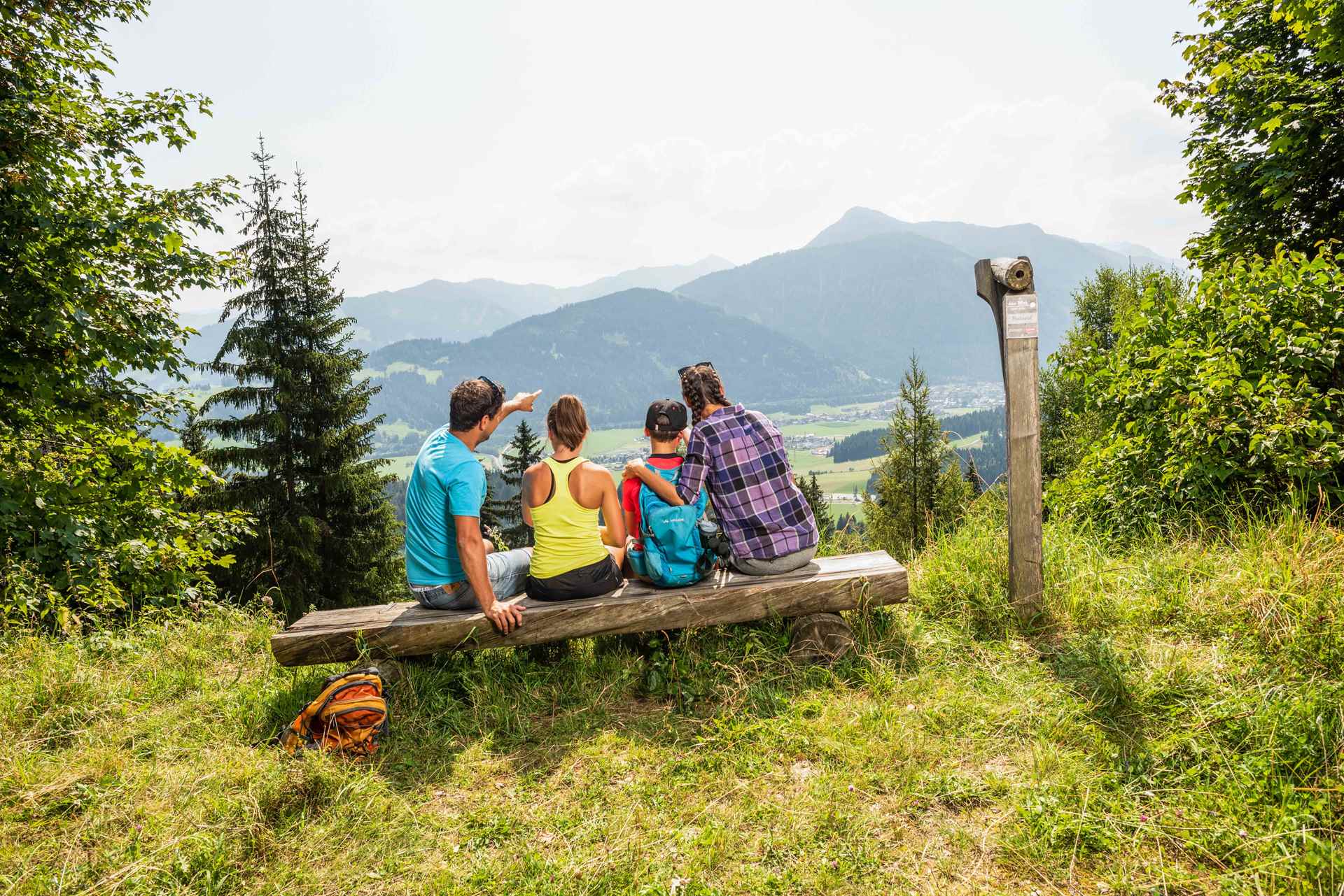 Family hiking in the mountains of Austria
